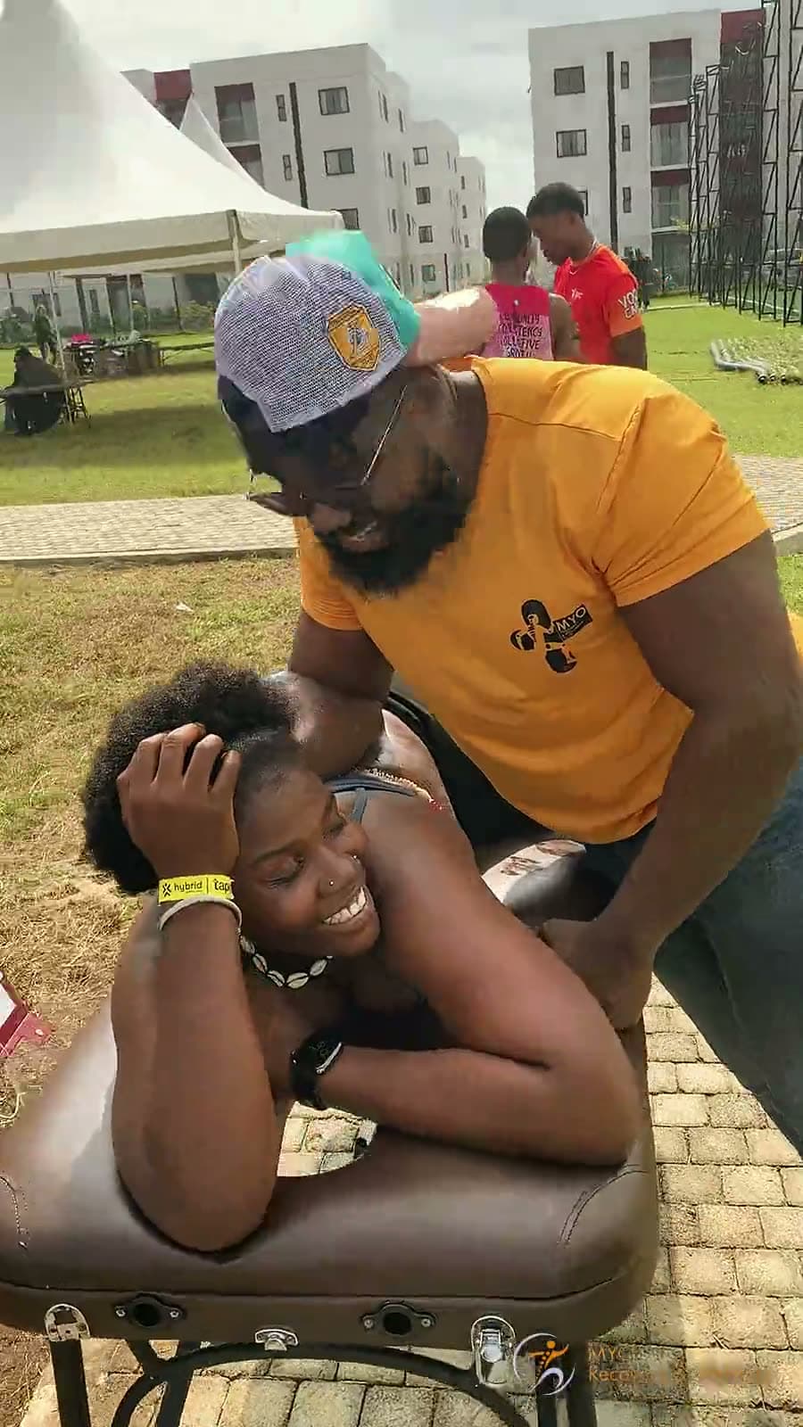 Eleven seconds of a MYO therapist working on a client's neck and shoulder at an outdoor community session
